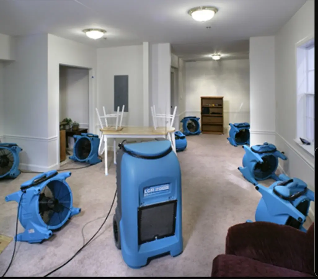 Air movers and dehumidifier setup for Water Damage Restoration in Lamont